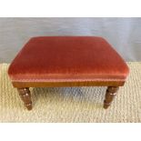 A late 19thC/early 20thC footstool with turned legs