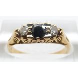 An 18ct gold ring set with a sapphire and two diamonds, size M/N, 3.