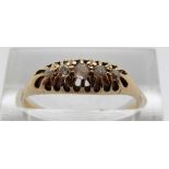 An 18ct gold ring set with five graduated diamonds, size P, 2.