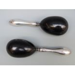 A pair of hallmarked silver and ebony darning/sewing eggs, Birmingham 1934 maker Chrisford & Norris,