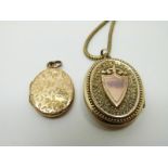 A Victorian yellow metal locket with scrolling decoration,