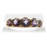 A 9ct gold ring set with five amethysts, size O, 2.