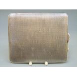 A George V hallmarked silver engine turned cigarette case, Birmingham 1934,