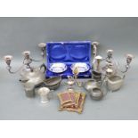 A collection of silver plate to include a pair of candelabra, pewter tea pot,