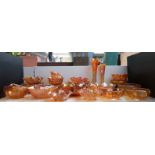Twenty-six pieces of mainly orange Carnival glass including Good Luck,