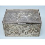A continental white metal box with hinged lid decorated with 18thC style Watteau scenes in relief
