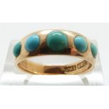 An 18ct gold Victorian ring set with five turquoise cabochons, size N/O, 4.