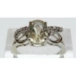 A 9ct gold ring set with a lemon quartz and diamonds, size N, 2.