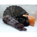 A vintage crocodile skin handbag, moleskin muff / bag,