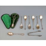 A set of six Danish white metal spoons, hallmarked silver tongs and similar spoon,