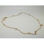 A yellow metal necklace marked 750,