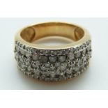 An 18ct gold ring set with diamonds in rows, size P,