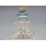 A hallmarked silver and guilloché enamel cut glass scent / perfume bottle,