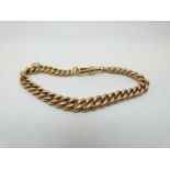 A 15ct gold graduated curb link bracelet,