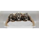 An 18ct gold ring set with three diamonds in a platinum setting, size I,