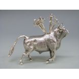A continental white metal novelty cocktail stick holder in the form of a bull, length 10cm,