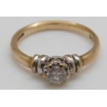 A 9ct gold ring set with a round cut diamond of approximately 0.