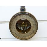 Martin & Co, Paris and Cheltenham, holosteric aneroid barometer in brass circular case.
