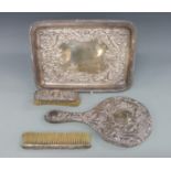 A Victorian embossed hallmarked silver dressing table tray, Chester 1899 maker William Aitken,