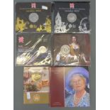 Three 2012 Olympic coins in original packages together with three Royal commemorative coin packs,