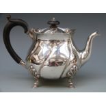 A Victorian hallmarked silver teapot with wrythen embossed decoration,