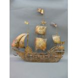 A large metal and wood wall plaque in the form of a galleon, possibly ex pub sign,