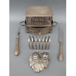 Goldsmiths and Silversmiths hinged lidded biscuit tin with looped lion mask handles, toast rack,