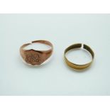 A 22ct gold wedding band (2g) and a 9ct gold signet ring (3g)
