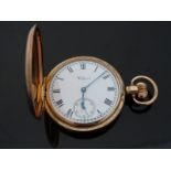 Waltham gold plated keyless winding full hunter pocket watch with black Roman numerals,