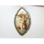 A Georgian/ Victorian brooch/ pendant set with a marquise shaped ivory miniature depicting a woman