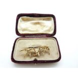 A Victorian 15ct gold brooch in the form of three swallows set with seed pearls,