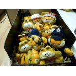 Fifteen Garfield soft toys including Policeman, Graduate, Pasta Lover,