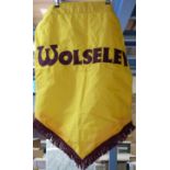 A Wolseley showroom or similar banner,