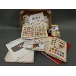 All-world stamps in a Nelson album, a Cadet album,