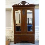 An oak mirror door wardrobe with single drawer below,