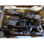 A quantity of vintage woodworking planes and tools