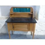 A satinwood tile back washstand,