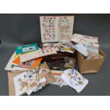A suitcase containing tins of loose stamps, other loose stamps,