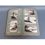 An Edwardian era postcard album with approximately 115 Japanese cards including a good percentage