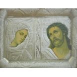 A framed icon mounted with nickel or similar embossed decoration.