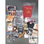 A collection of film and TV memorabilia including Mr Bean's bear and Twelve Weeks in Hong Kong by