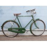 A vintage ladies bicycle with rod brakes