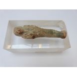 An Egyptian Shabti on perspex block