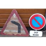 A 'bend' road sign and a 'Sauf Mairie' sign