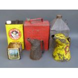 A quantity of vintage oil and petrol cans including Shell 2 gallon example,