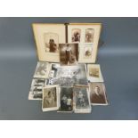 A Victorian Carte Visite album and a collection of loose vintage postcards including stage and