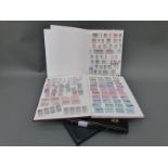 A stockbook of Irish stamps and three stockbooks of USA stamps including some mint
