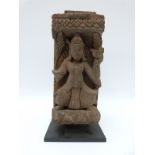 A 19thC Napalese carved wooden fragment on stand,