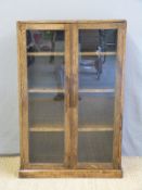 A glazed oak bookcase,