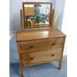 An oak two drawer dressing chest with mirror above,